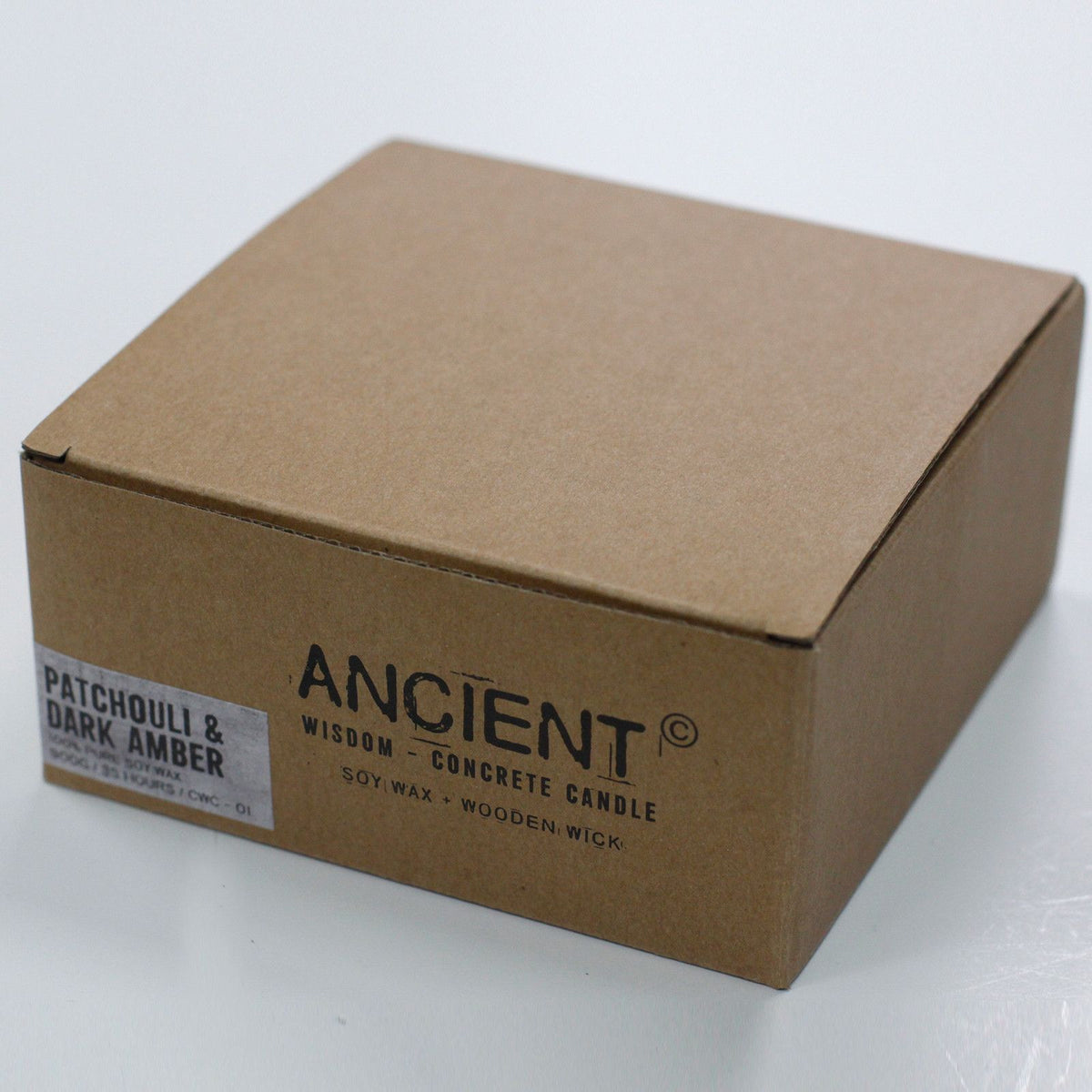 Brown cardboard box with 'Ancient Wisdom' candle branding on a white background