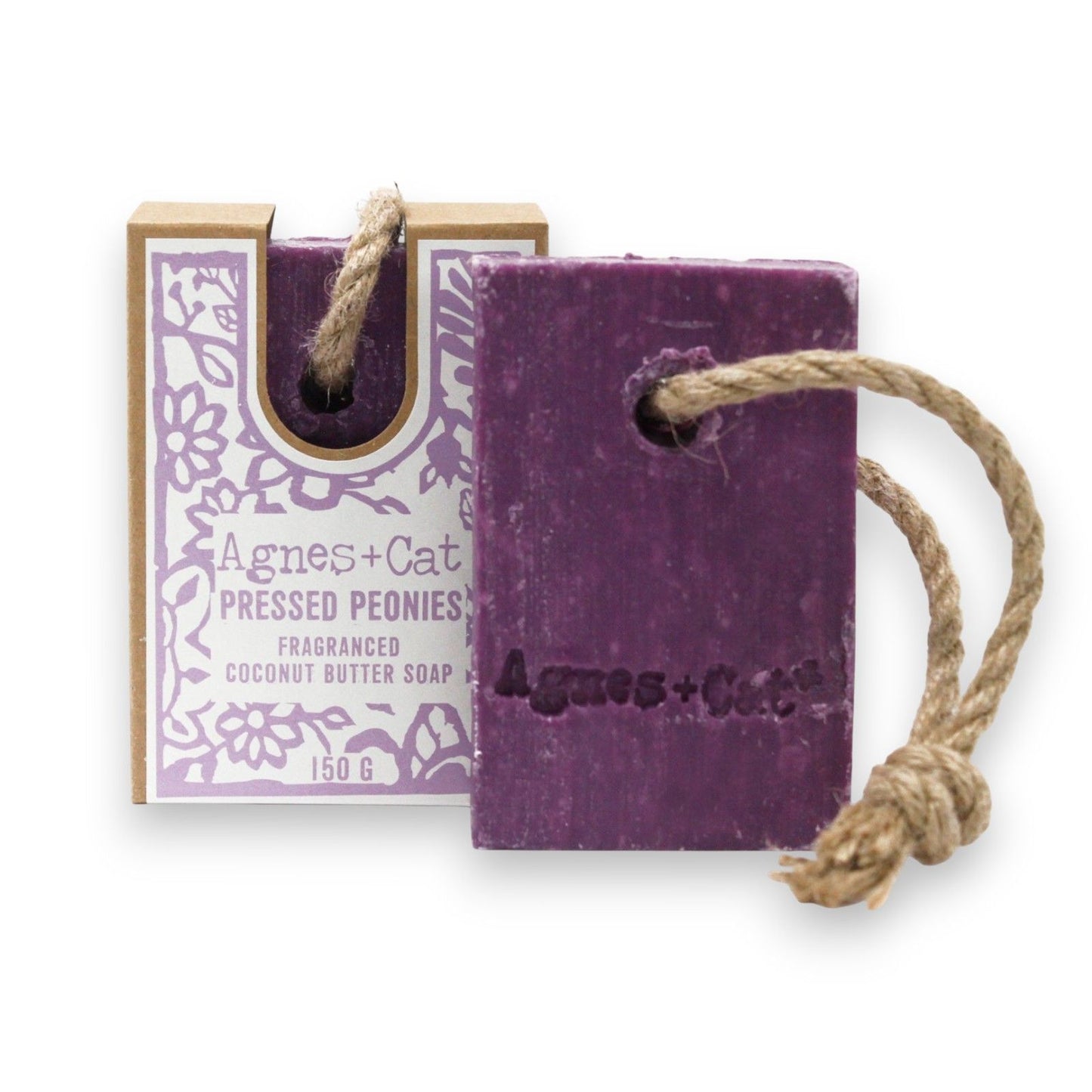 "Pressed Peonies" purple soap bar with rope and packaging labeled 'Agnes + Cat' on a white background