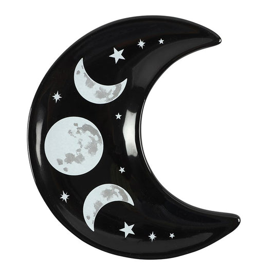 Black ceramic plate shaped like a crescent moon with moon phases and stars on a white background