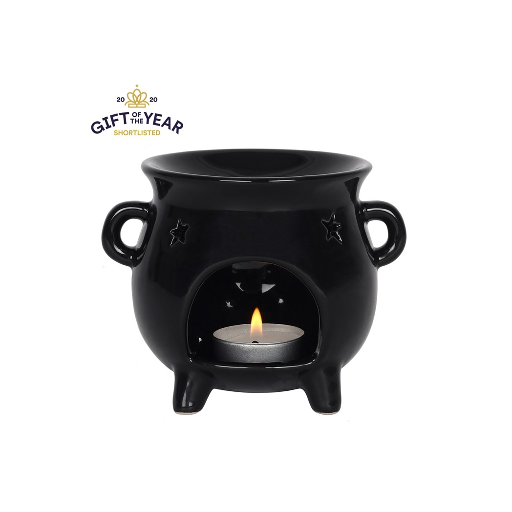 Black ceramic oil burner with a lit candle inside on a white background, featuring 'Gift of the Year' shortlisted badge.