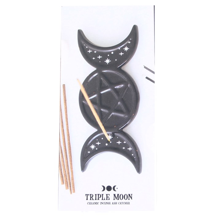 A black ceramic Triple Moon incense holder set on its white retail card packaging, featuring a central pentagram moon and two crescent moons with white star details, accompanied by two wooden incense sticks.