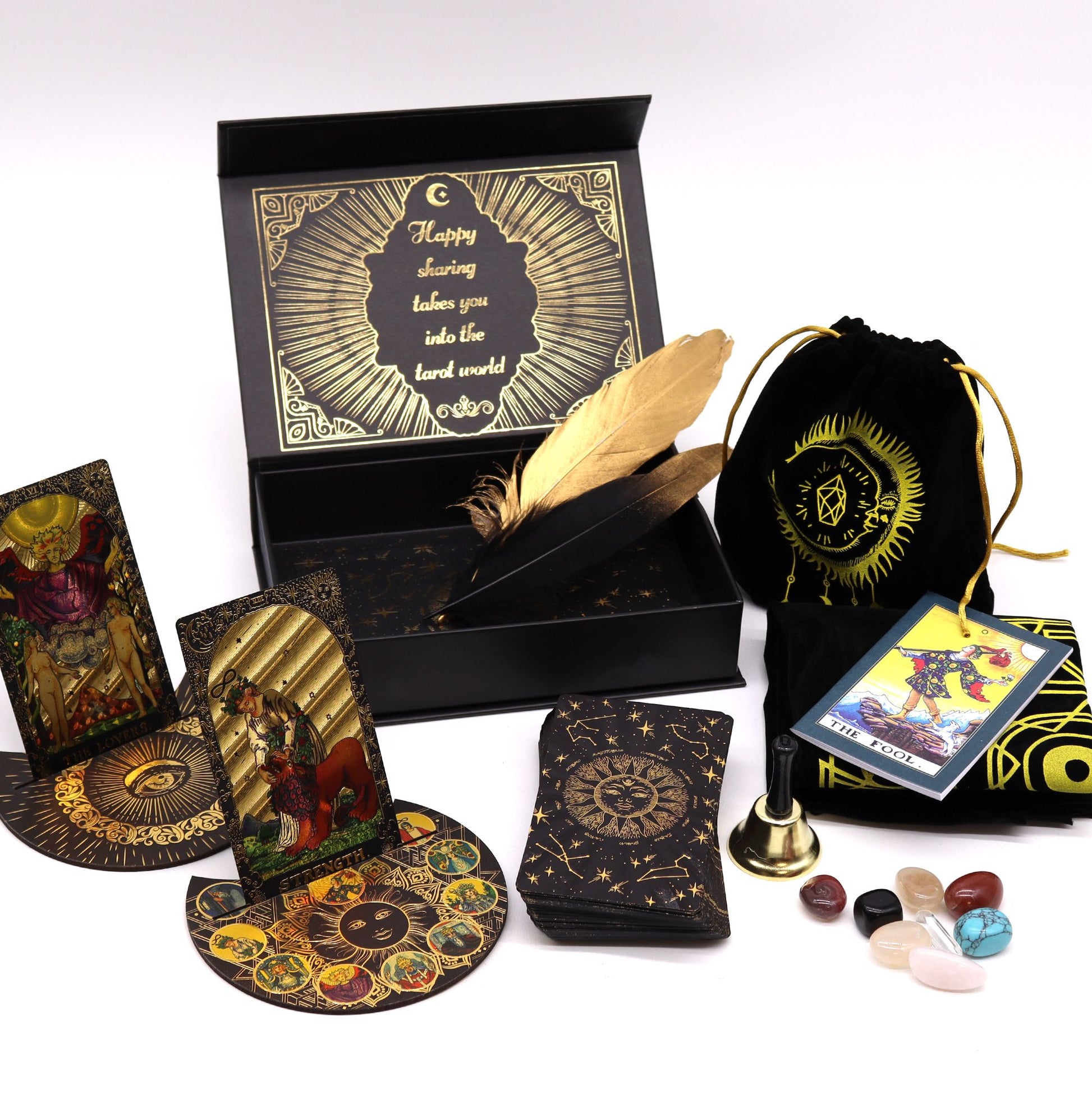  A selection of Mystical Tools – Includes a ritual bell, divination stones, a celestial tarot cloth, and feather quills 