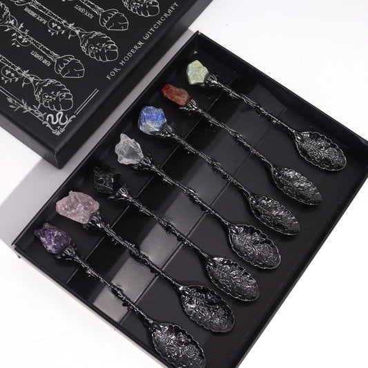 Set of decorative spoons with embedded crystals in a black box