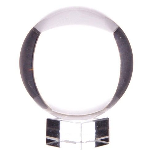 Crystal ball on a stand with a white background