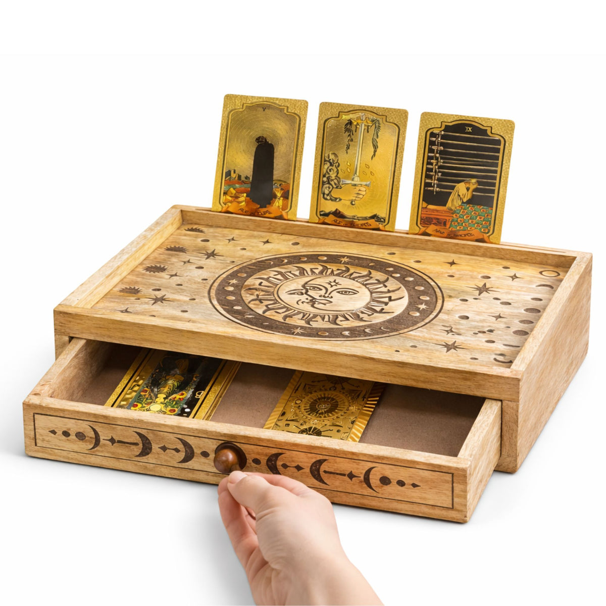 Wooden tarot card deck with cards displayed and a hand opening a drawer.