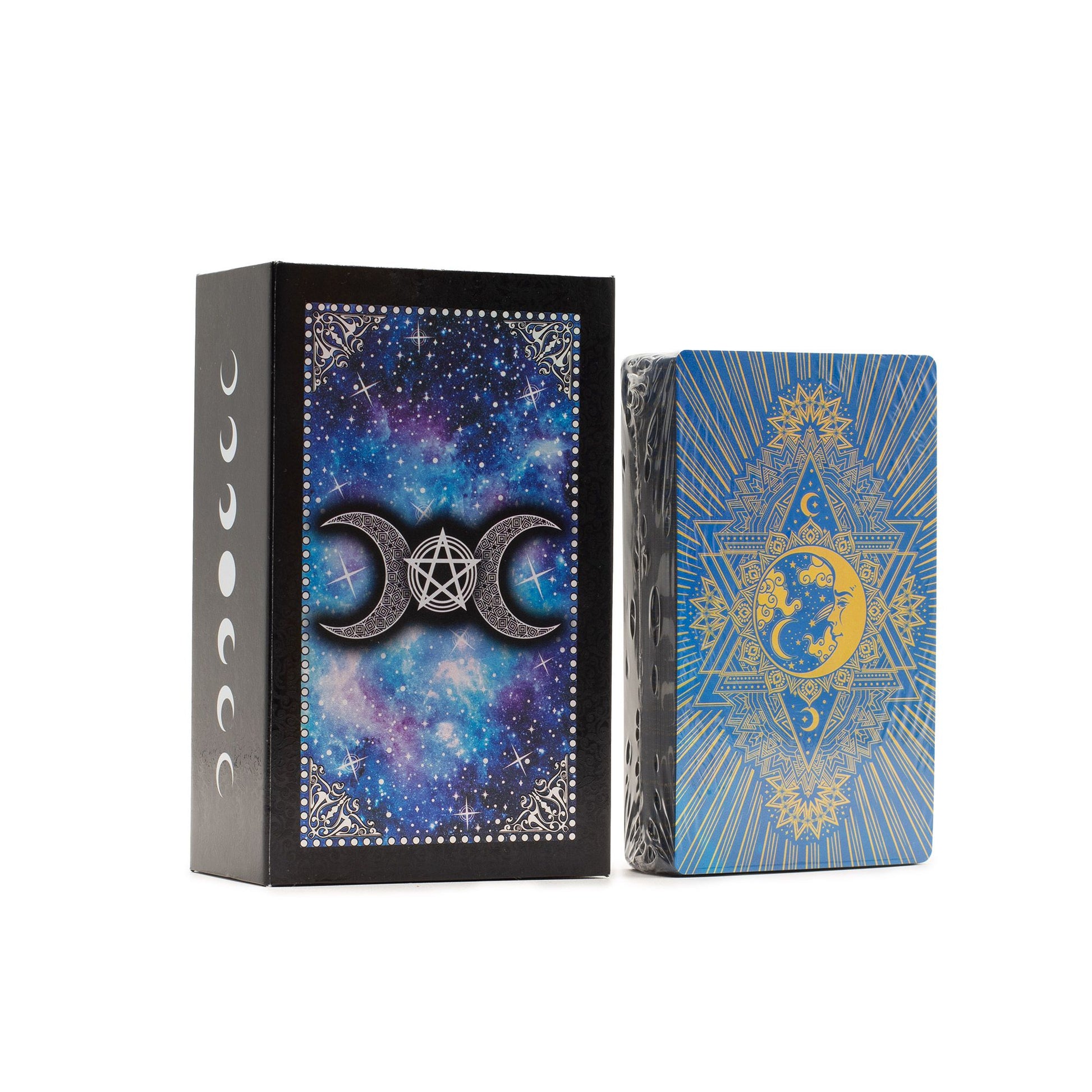 Two tarot card decks with celestial designs on a wooden surface