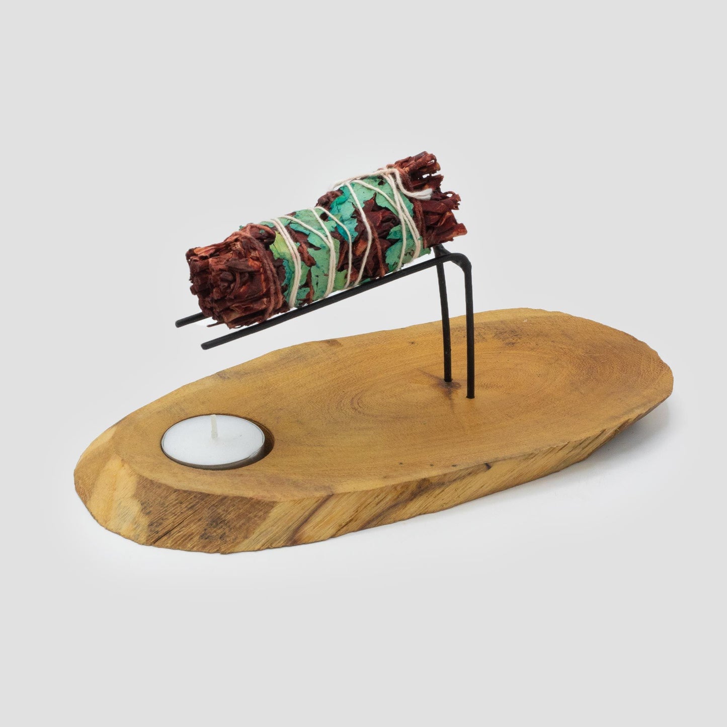 Palo Santo Heater  handcrafted  from Natural Gamel wood with metal supports holding a smudge stick and an indentation for a tea light