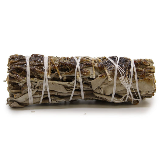 A smudge stick bundle of sage leaves tied together, traditionally used in rituals of purification and cleansing, fragranced with Copal