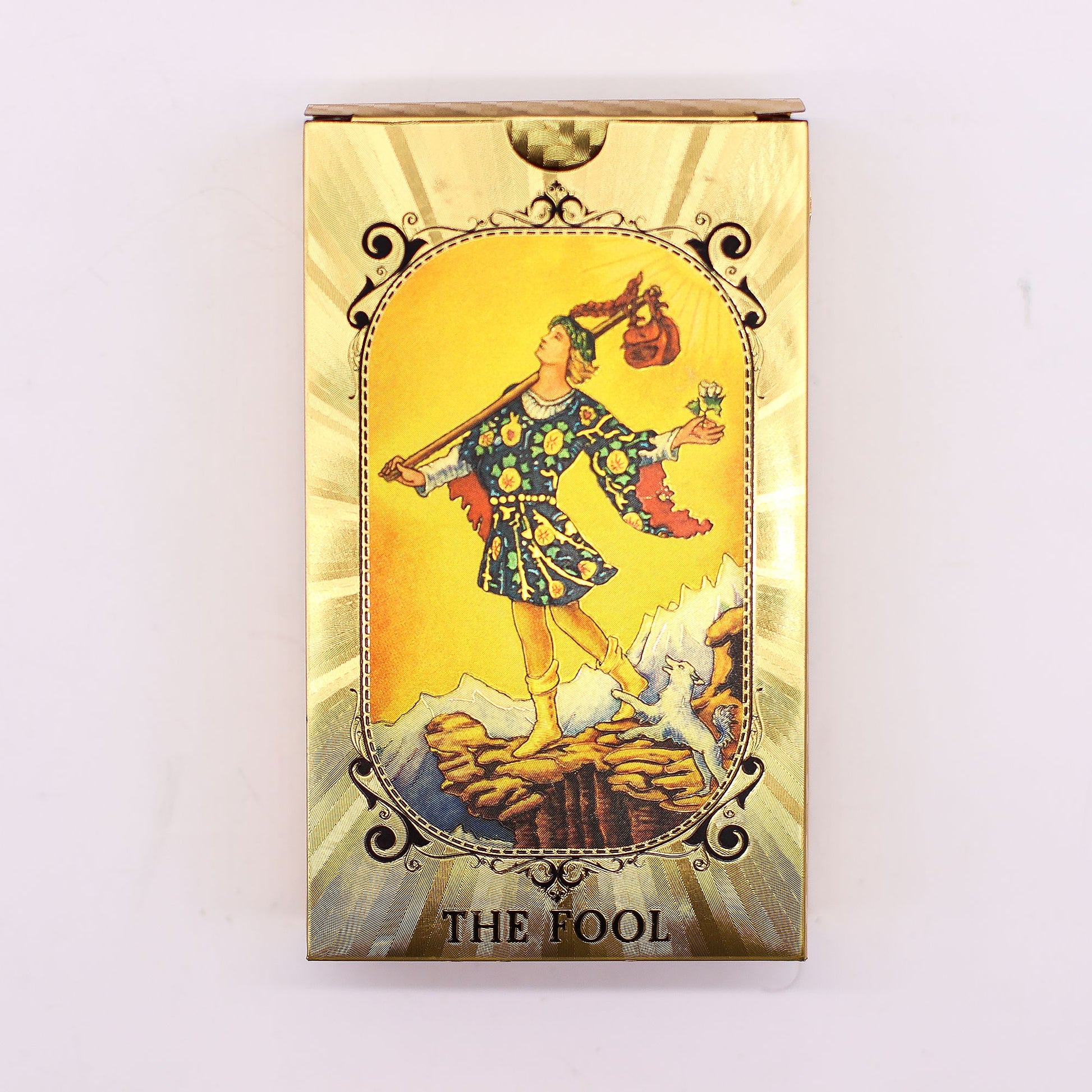 Tarot card titled 'The Fool' on a purple fabric background