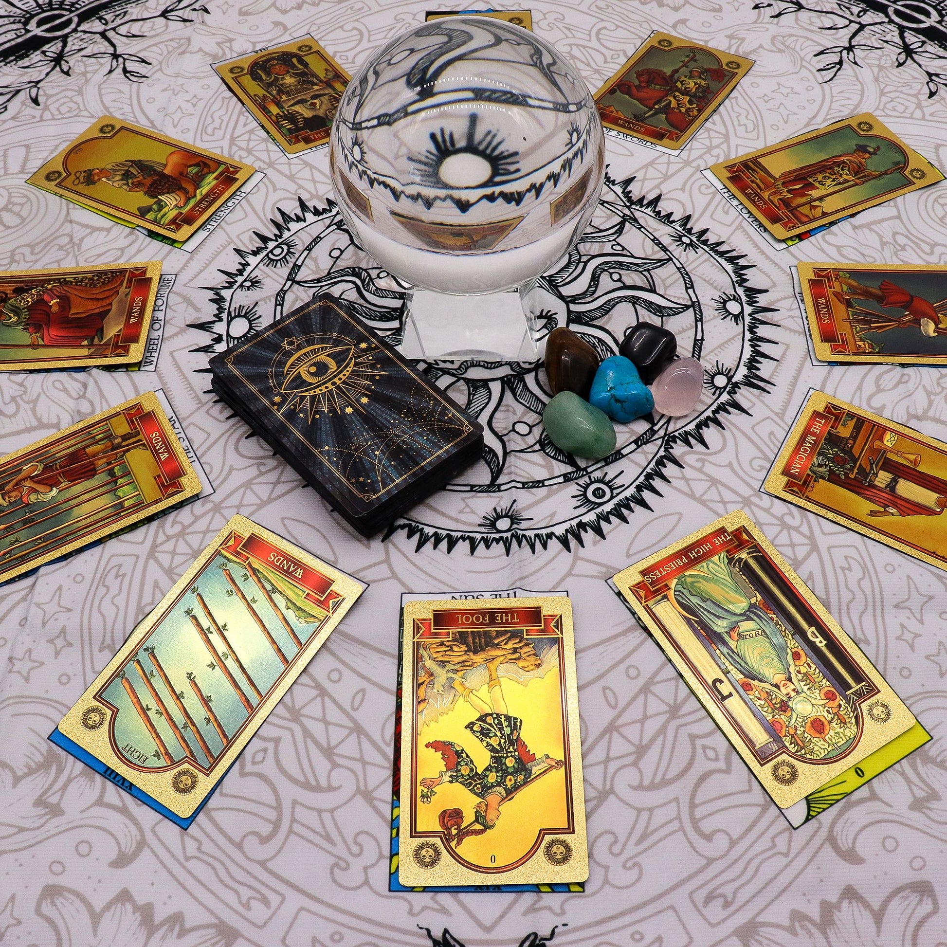 Tree of Life Tarot Cloth shwin tarot cards on a grey background with cards. crystal ball & crystals