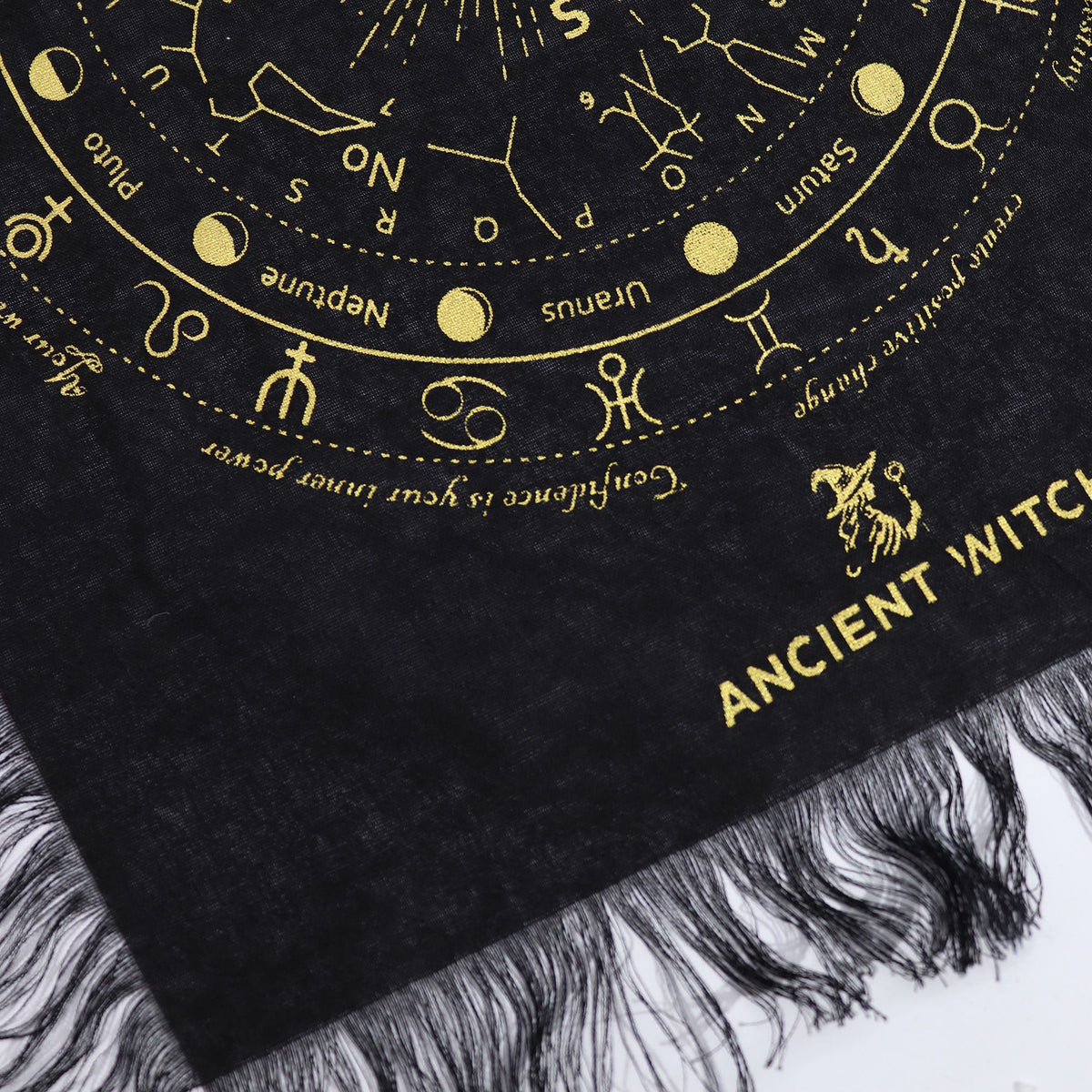 Black scarf with gold astrological symbols and 'Ancient Witch' text on a textured surface