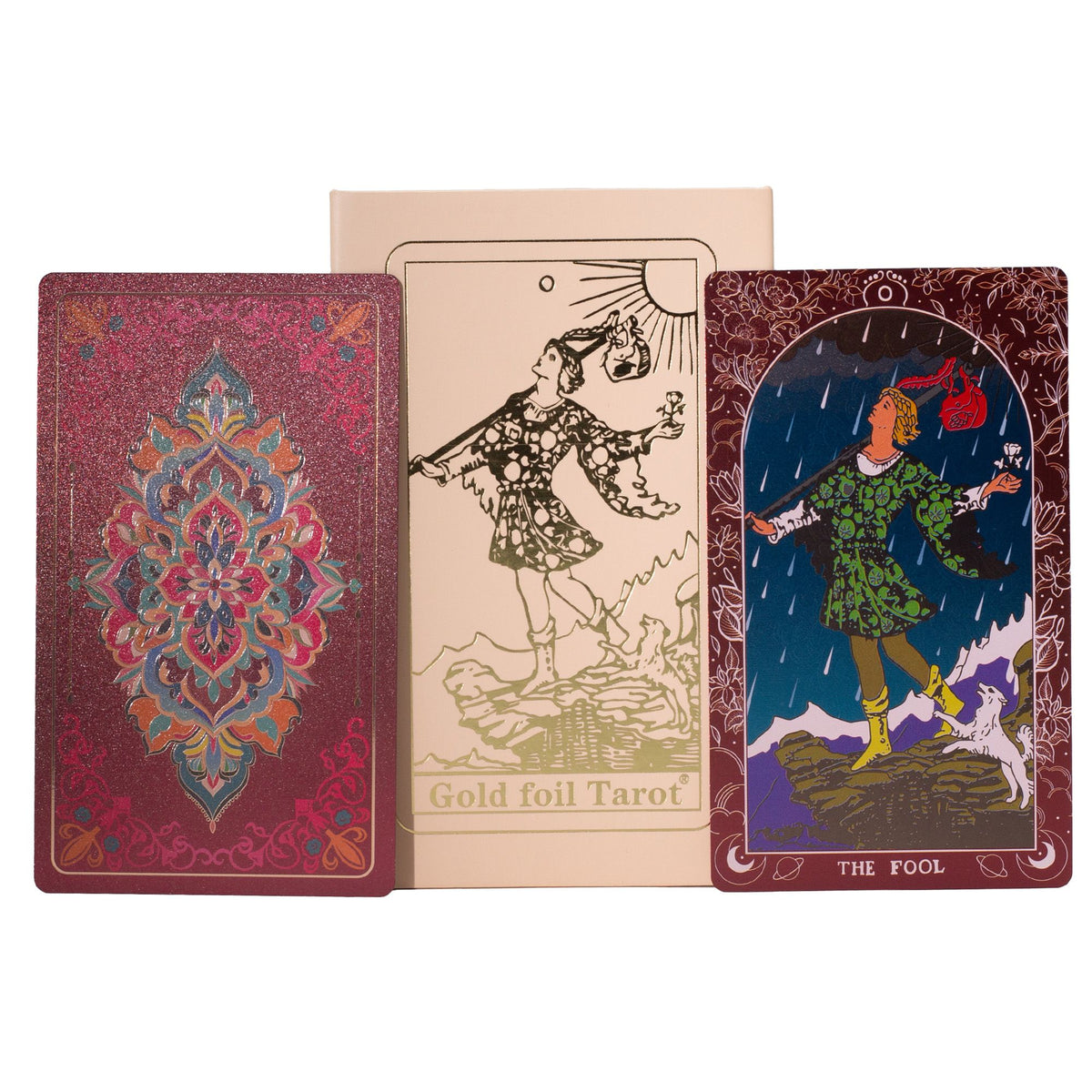 Gold foil tarot deck showing the back design on the left, the 'Gold foil Tarot' title card in the center, and the 'The Fool' card on the right, all displayed against a plain white background.
