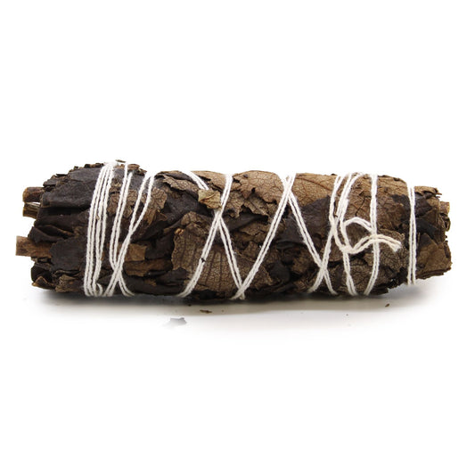 A smudge stick bundle of sage leaves tied together, traditionally used in rituals of purification and cleansing, fragranced with Black Yerba Santa