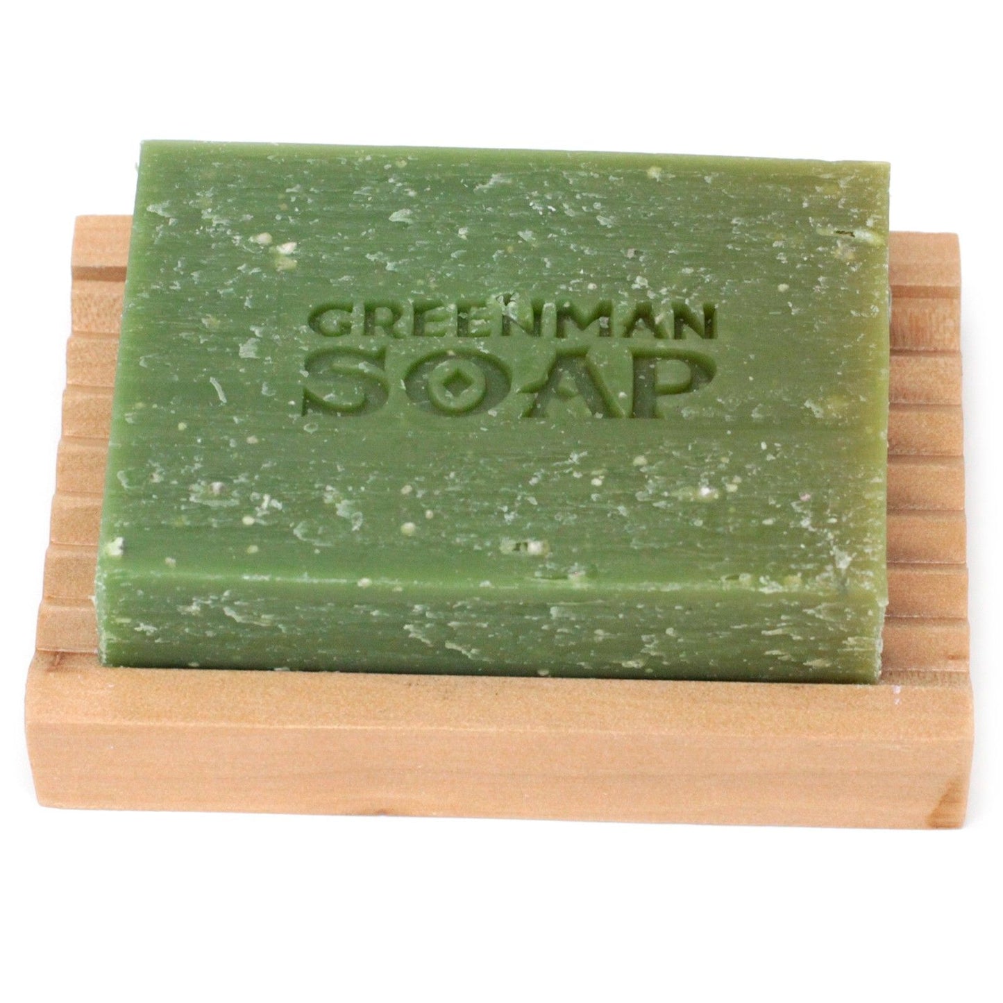 Green bar of soap on a wooden soap dish with 'Greenman Soap' branding.