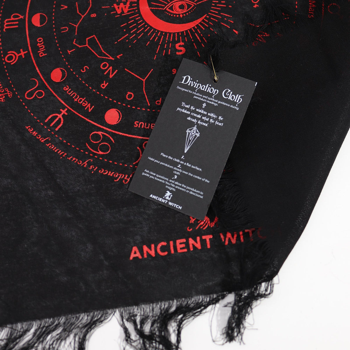 Black divination cloth with red symbols and 'Ancient Witch' branding, featuring a tag.