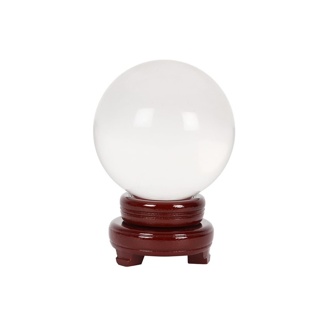 Crystal ball on wooden stand on white background
